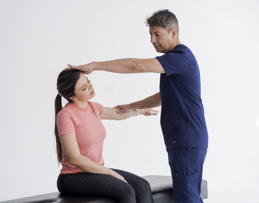 Chiropractor Dallas TX Iohann Gonzalez Adjusting Patients Neck